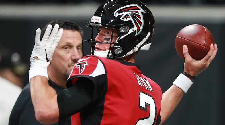 Atlanta Falcons passing game coordinator Greg Knapp looks on as quarterback Matt Ryan prepares to play the Kansas City Chiefs Friday, Aug. 17, 2018, at Mercedes-Benz Stadium in Atlanta.