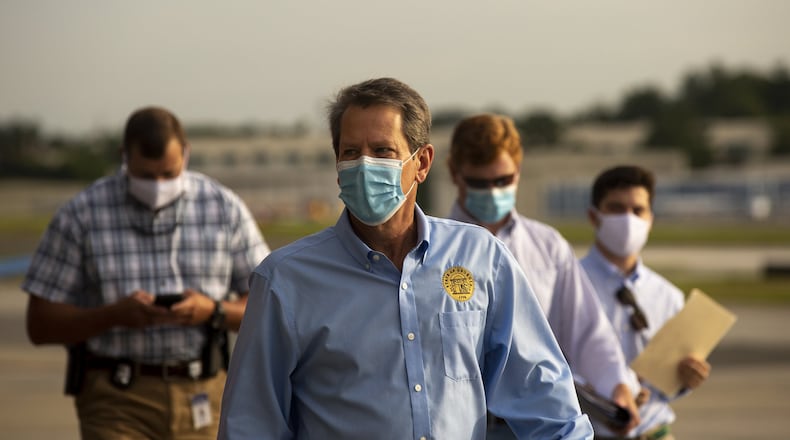 Georgia Gov. Brian Kemp prepares to speak at the start of a “Wear A Mask” tour. (REBECCA WRIGHT FOR THE ATLANTA JOURNAL-CONSTITUTION)