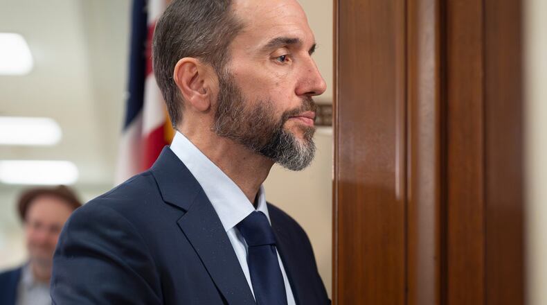 Former Department of Justice Special Counsel Jack Smith enters a room in the Rayburn House Office Building to give his deposition before the House Judiciary Committee, part of its oversight into DOJ investigations into President Donald Trump, on Capitol Hill in Washington, Wednesday, Dec. 17, 2025. (AP Photo/J. Scott Applewhite)