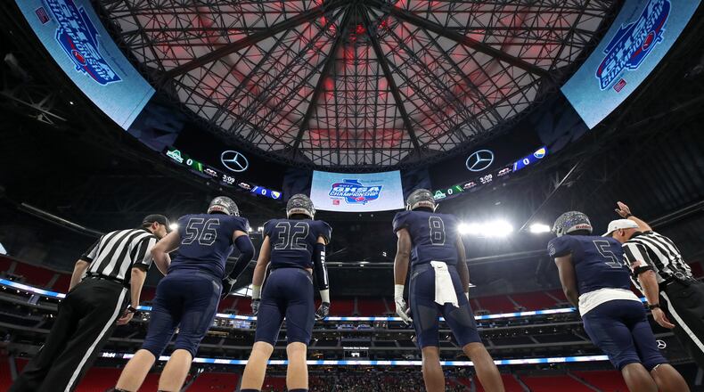 Eagle's Landing Christian captains Zack Jones (from left), George Shockley, Tre' Douglas and Josh Mays line up for the coin toss before Class A-Private Championship game against Athens Academy Dec. 8, 2017, at Mercedes-Benz Stadium in Atlanta.