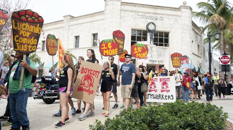 Coalition of Immokalee Workers marches on Worth Avenue.