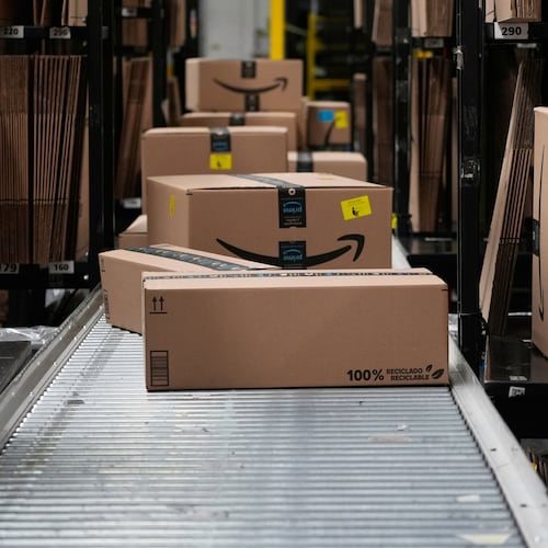 FILE - Boxes sit on a conveyor belt at an Amazon storage warehouse in Tepotzotlan, Mexico, May 22, 2025. (AP Photo/Marco Ugarte, File)
