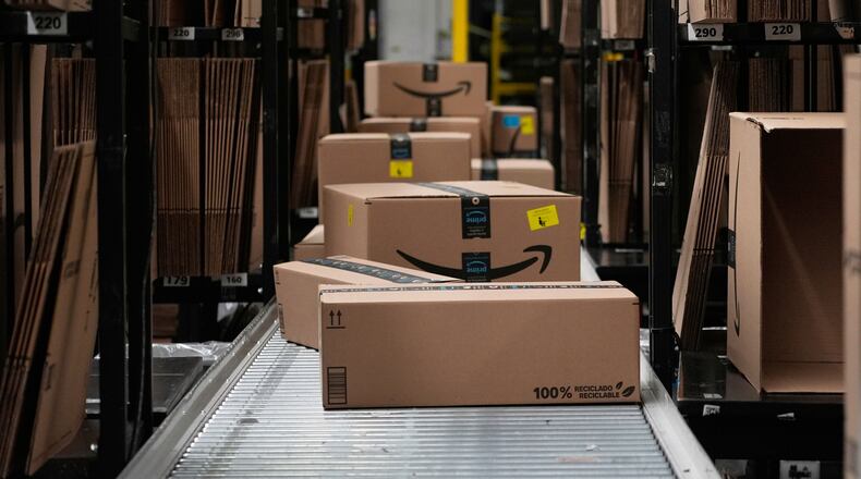 FILE - Boxes sit on a conveyor belt at an Amazon storage warehouse in Tepotzotlan, Mexico, May 22, 2025. (AP Photo/Marco Ugarte, File)