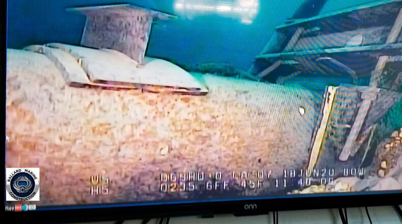 FILE - This photo provided by the Michigan Department of Environment, Great Lakes, and Energy in June 2020 shows damage to anchor support EP-17-1 on the east leg of the Enbridge Line 5 pipeline in the Straits of Mackinac in Michigan, displayed on a television screen. (Michigan Department of Environment, Great Lakes, and Energy via AP, File)