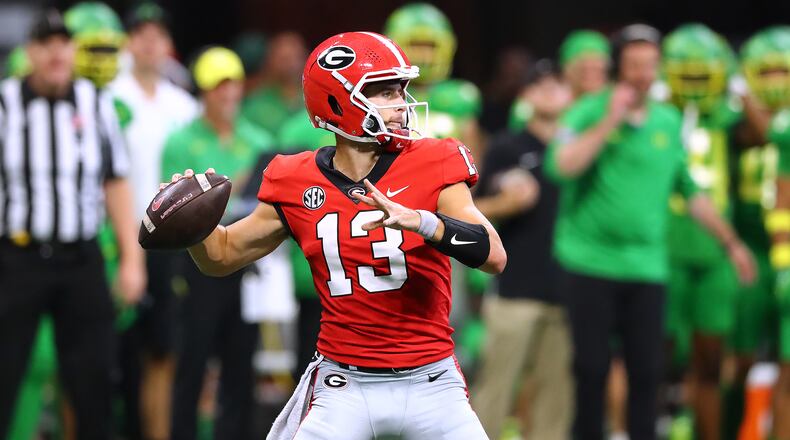 Georgia quarterback Stetson Bennett throws for a first down on a scoring drive against Oregon on the way to a 28-3 lead during the second quarter Saturday, Sept. 3, 2022, in Atlanta. “Curtis Compton / Curtis Compton@ajc.com