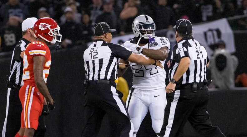Oakland Raiders running back Marshawn Lynch (24) in an altercation with the referees during the second quarter against the Kansas City Chiefs at Oakland Coliseum.