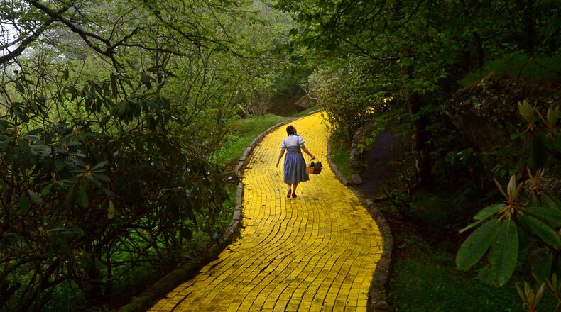 Dressed as Dorothy, Jana Greer leads a tour down the Yellow Brick Road at the Land of Oz on June 5, 2015 in Beech Mountain, N.C. (Todd Sumlin/Charlotte Observer/TNS)