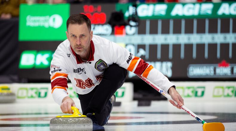 FILE - Brad Gushue, skip of Team Newfoundland and Labrador-Gushue, delivers his stone during Draw 17 at the Montana's Brier Canadian men's curling championship in St. John's, N.L., March 5, 2026. (Paul Daly/The Canadian Press via AP, File)