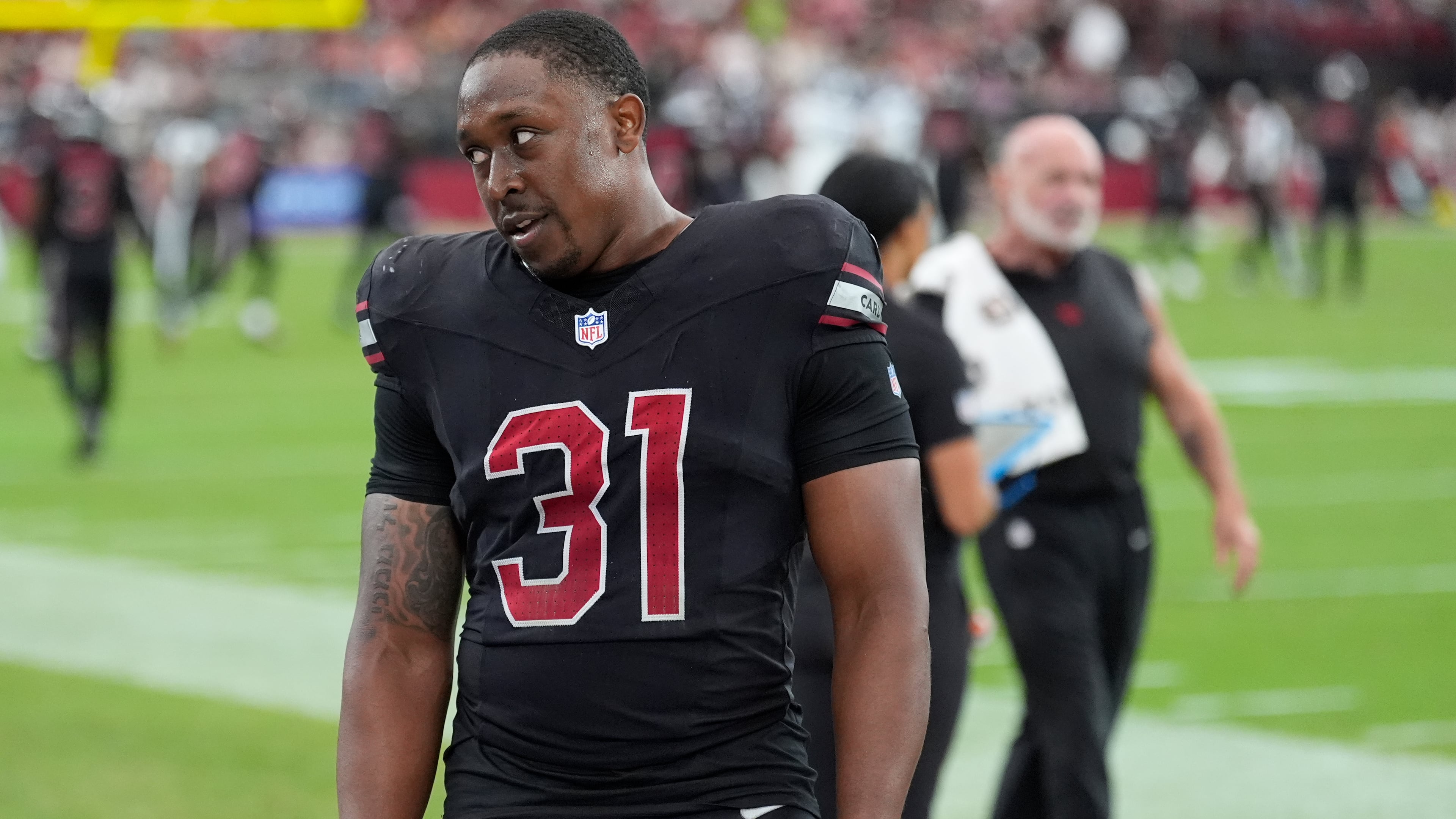 Arizona Cardinals running back Emari Demercado (31) reacts on the sideline after fumbling the ball out of the end zone on a touchdown run during the second half of an NFL football game against the Tennessee Titans, Sunday, Oct. 5, 2025, in Glendale, Ariz. (AP Photo/Ross D. Franklin)
