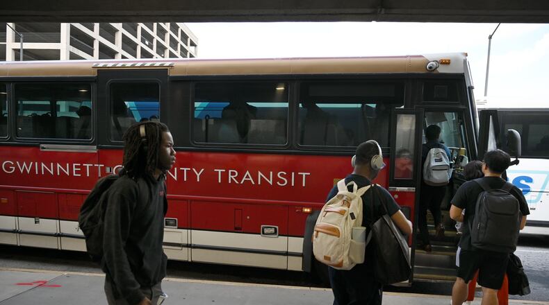 Customers get on Gwinnett County Transit bus at the Civic Center MARTA station, Thursday, September 19, 2024, in Atlanta. This is for a story about the history of failed transit expansions in Gwinnett and Cobb, previewing the November transit referendum in both counties. (Hyosub Shin / AJC)