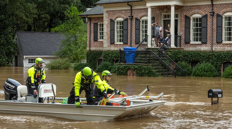 Atlanta Fire Rescue’s Dive/Swift Water Team performed welfare checks on residents on Hanover West Drive in Atlanta, after Helene entered Georgia as a Category 2 hurricane Sept. 27, 2024 and then was downgraded to a tropical storm. It brought a lot of problems to Atlanta with numerous water rescues and incessant rain. (John Spink/AJC)