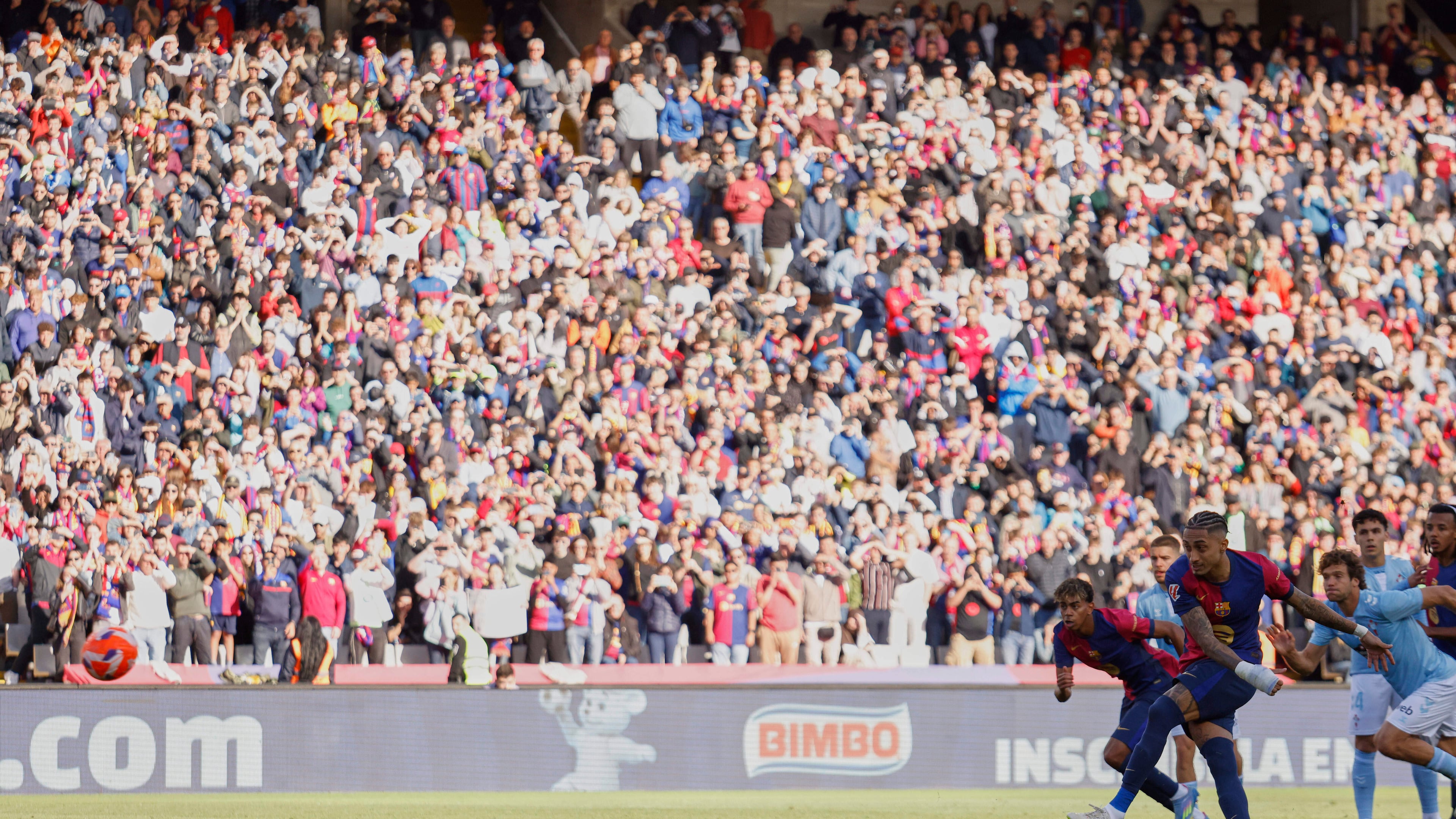 FILE -Barcelona's Raphinha shoots a penalty kick to score during a Spanish La Liga soccer match between Barcelona and Celta de Vigo at the Lluis Companys Olympic stadium in Barcelona, Spain, April 19, 2025. (AP Photo/Joan Monfort, File)