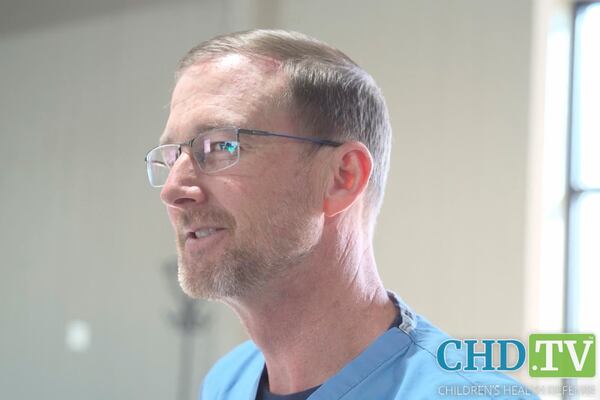 This image from video posted on the Children's Health Defense website on March 31, 2025, shows Dr. Ben Edwards with a measles rash on his face, while working in a makeshift clinic in Seminole, Texas. (AP Photo)