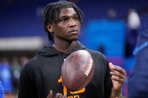 FILE - Miami quarterback Cam Ward watches a drill at the NFL football scouting combine in Indianapolis, Saturday, March 1, 2025. (AP Photo/George Walker IV,File)