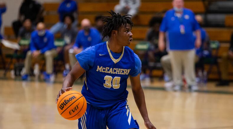 Mike Jacobs (30), guard for McEachern, dribbles down the court during the Grayson vs. McEachern high school boys basketball playoff game on Saturday, February 27, 2021, at Grayson High School in Loganville, Georgia. McEachern defeated Grayson 57-56 in overtime. CHRISTINA MATACOTTA FOR THE ATLANTA JOURNAL-CONSTITUTION