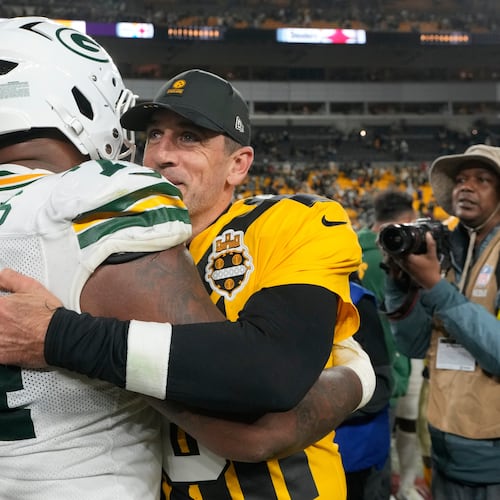 Pittsburgh Steelers' Aaron Rodgers hugs Green Bay Packers' Elgton Jenkins after an NFL football game Sunday, Oct. 26, 2025, in Pittsburgh. (AP Photo/Sue Ogrocki)