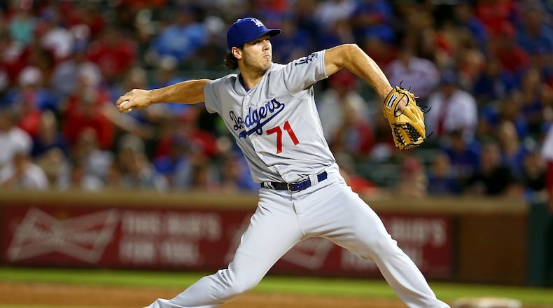 Josh Ravin of the Dodgers pitches in the ninth inning during a game against the  Rangers at Globe Life Park in Arlington on June 16, 2015 in Arlington, Texas. The Braves acquired Ravin in November 2017. (Photo by Sarah Crabill/Getty Images)