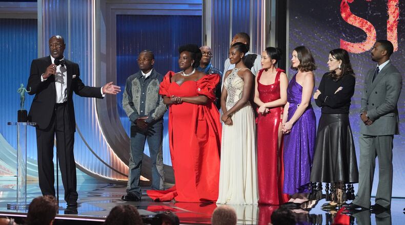 Delroy Lindo, from left, Miles Canton, Wunmi Mosaku, Omar Benson Miller, Jayme Lawson, Li Jun Li, Lola Kirke, Francine Maisler, and Michael B. Jordan accept the award for outstanding performance by a cast in a motion picture for "Sinners" during the 32nd Annual Actor Awards on Sunday, March 1, 2026, at the Shrine Auditorium and Expo Hall in Los Angeles. (AP Photo/Chris Pizzello)