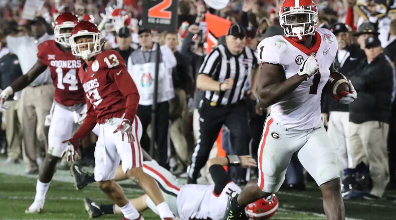 Georgia tailback Sony Michel breaks away for a touchdown in the second overtime to beat Oklahoma, 54-48, in the Rose Bowl Monday, Jan. 1, 2018, in Pasadena, Calif.