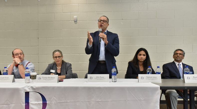 US Congress District 7 candidate John Eaves speaks as other candidates wait for their turn to speak during Candidate Forum hosted by Gwinnett Democratic Women at George Pierce Park’s community room in Suwanee on Saturday, September 28, 2019. (Hyosub Shin / Hyosub.Shin@ajc.com)