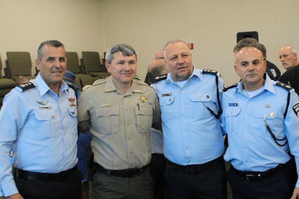 Floyd County Sheriff Dave Roberson (second from left) poses for photos with some top Israeli law enforcement officials. (Photo courtesy of Adam Carey)