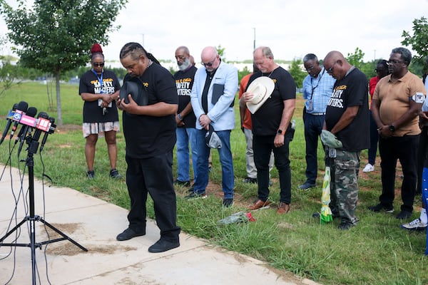 American Postal Workers Union President Jonathan Smith and others hold a moment of silence to honor the four U.S. Postal workers who died at the Atlanta Regional Processing and Distribution Center, Thursday, July 9, 2026. (Jason Getz/AJC)