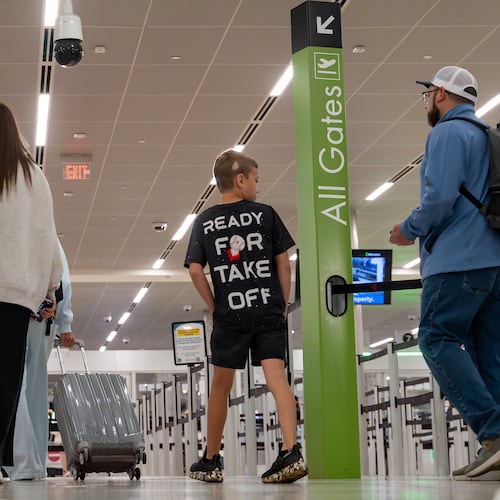 Morning travelers enter the main checkpoint at Hartsfield-Jackson Atlanta International Airport, Friday, Apr 4, 2026. (Ben Hendren for the AJC)
