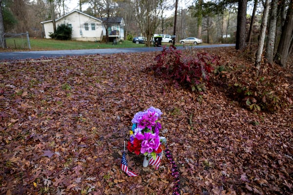 A memorial for Donna Nguyen appears by Dixie Lake on Lakeside Drive in Union City on Wednesday, Nov. 26, 2025. At least one dog fatally mauled Nguyen in an incident so gruesome that it is changing the structure of animal control in Georgia’s most populous county. (Arvin Temkar/AJC)