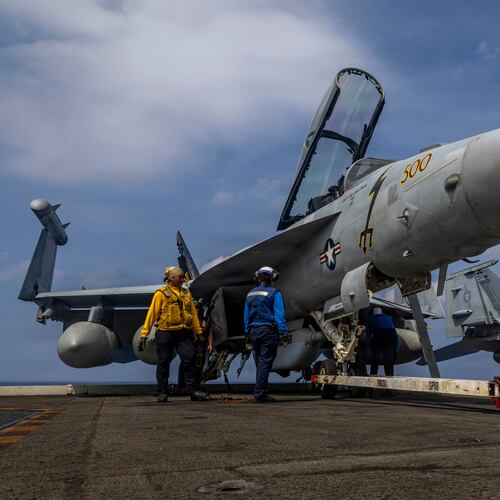 This photo provided by the U.S. Navy shows sailors preparing a Boeing EA-18G Growler on the flight deck of the Nimitz-class aircraft carrier USS Abraham Lincoln in the Indian Ocean on Jan. 21, 2026. (Mass Communication Specialist Seaman Daniel Kimmelman/U.S. Navy via AP)
