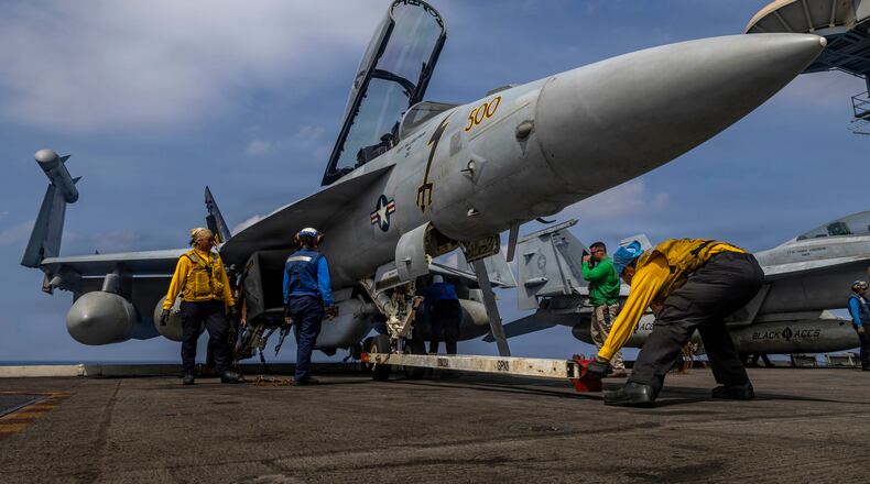 This photo provided by the U.S. Navy shows sailors preparing a Boeing EA-18G Growler on the flight deck of the Nimitz-class aircraft carrier USS Abraham Lincoln in the Indian Ocean on Jan. 21, 2026. (Mass Communication Specialist Seaman Daniel Kimmelman/U.S. Navy via AP)