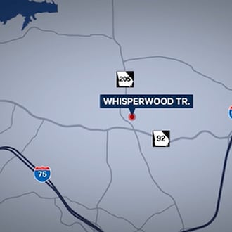 A man was killed by deputies at a home on Whisperwood Trail in Cherokee County, where his mother was found dead inside Saturday night, the sheriff's office said. (Courtesy of WSB-TV)