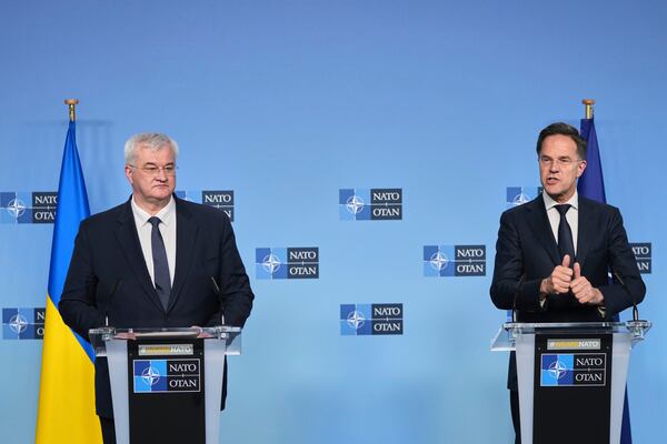 NATO Secretary General Mark Rutte, right, and Ukraine's Foreign Minister Andrii Sybiha address the media at NATO headquarters in Brussels, Thursday, April 3, 2025. (AP Photo/Virginia Mayo)