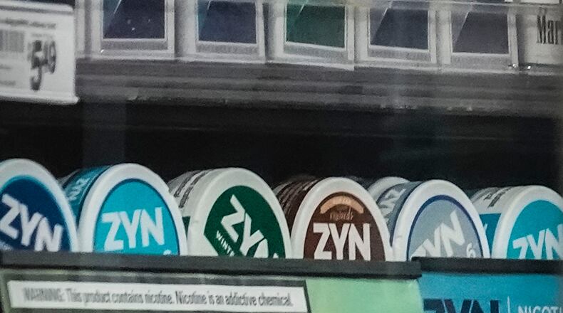 FILE - Containers of Zyn, a smokeless nicotine pouch, are displayed for sale among other nicotine and tobacco products at a newsstand on Feb. 23, 2024, in New York. (AP Photo/Bebeto Matthews, File)