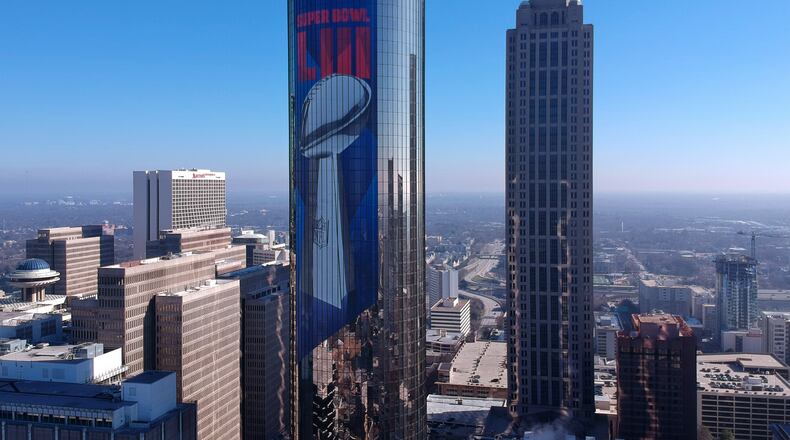 The Westin Peachtree Plaza with Super Bowl signage wrapped around the building in downtown Atlanta.