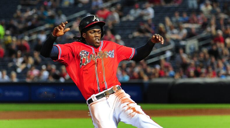 Cameron Maybin slides in to third base during the fifth inning against the Philadelphia Phillies at Turner Field on May 6, 2015. (Photo by Scott Cunningham/Getty Images)