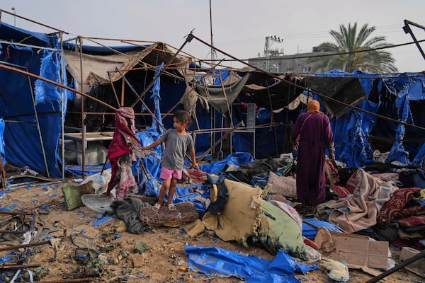 Palestinians inspect the damage caused by an Israeli airstrike that struck tents at Al-Aqsa Hospital in Deir al-Balah, central Gaza Strip, Saturday, May 17, 2025. (AP Photo/Abdel Kareem Hana)
