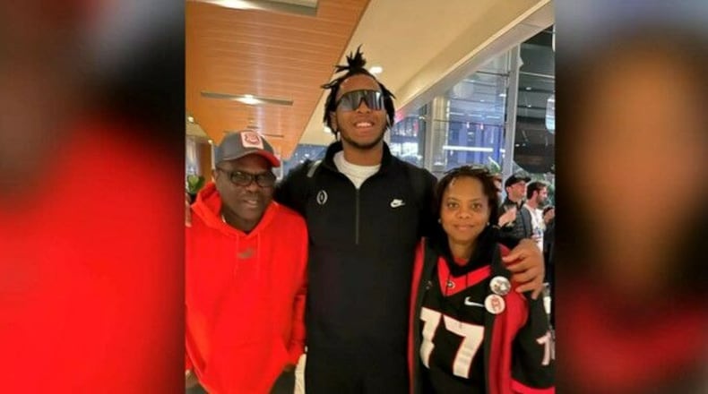 Devin Willock (center) with his parents, Dave and Sharlene Willock.