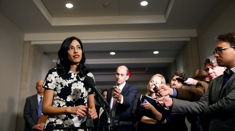 FILE - In this Oct., 16, 2015 file photo, Huma Abedin, a longtime aide to Hillary Rodham Clinton, speaks to the media after testifying at a closed-door hearing of the House Benghazi Committee, on Capitol Hill in Washington. The longtime Hillary Clinton aide at the center of a renewed FBI email investigation testified under oath four months ago she never deleted old emails, despite promising in 2013 not to take sensitive files when she left the State Department. (AP Photo/Alex Brandon, File)