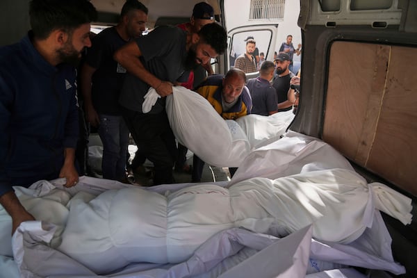 Bodies of Palestinians killed in the Israeli army airstrikes are brought to Al-Shifa Hospital in Gaza City, Monday, May 26, 2025. (AP Photo/Jehad Alshrafi)