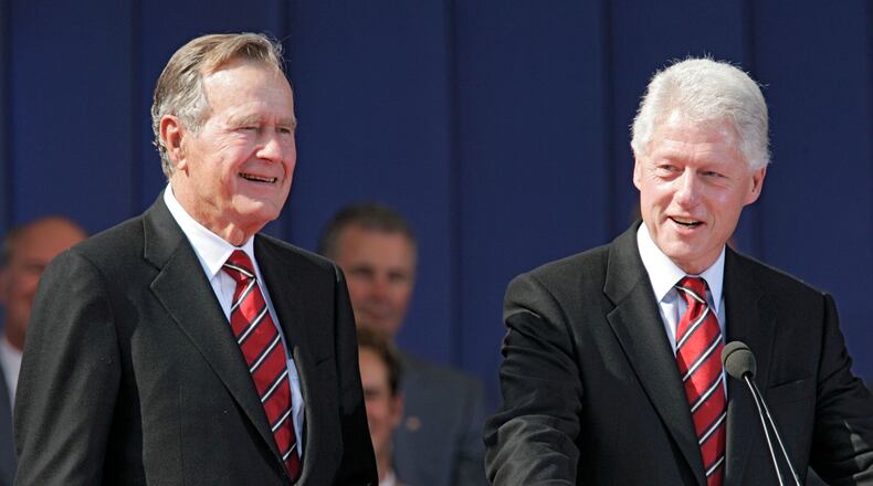 Former United States Presidents George H.W. Bush and Bill Clinton pictured in 2005.