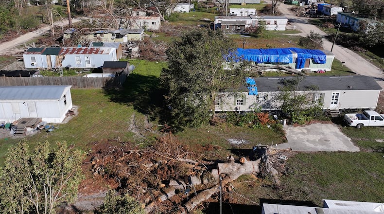 Areal photo shows the Pecan Park mobile home community surrounded by debris in the aftermath of Hurricane Helene, Monday, October 21, 2024, in Hazelhurst. (Hyosub Shin / AJC)
