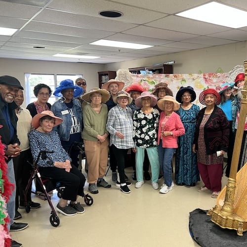 Crabapple Senior Center participants with harpist Lisa Handman in one of the many programs provided through Fulton County Senior Services. (Courtesy of Senior Services North Fulton)