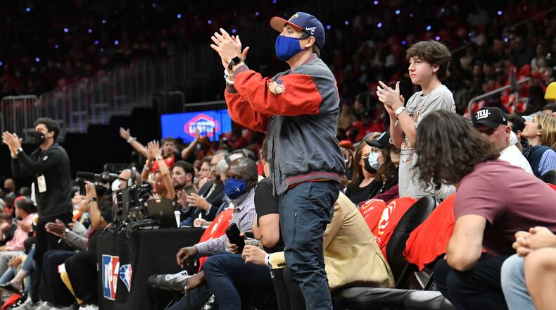 October 21, 2021 Atlanta - Atlanta Braves fan cheers during the first half of the home opener in a NBA basketball game at State Farm Arena on Thursday, October 21, 2021. (Hyosub Shin / Hyosub.Shin@ajc.com)