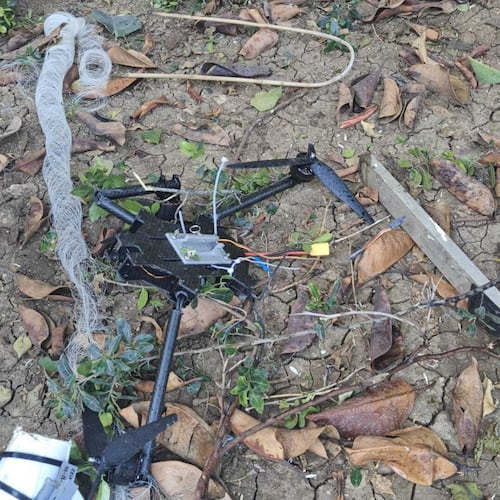This photo provided by Zevik Glidai shows a fiber-optic drone surrounded by cables lying in the backyard of his home in Kiryat Shmona, Israel, after being brought over the border from Lebanon, Monday, April 13, 2026. (Zevik Glidai via AP)