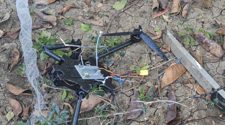 This photo provided by Zevik Glidai shows a fiber-optic drone surrounded by cables lying in the backyard of his home in Kiryat Shmona, Israel, after being brought over the border from Lebanon, Monday, April 13, 2026. (Zevik Glidai via AP)