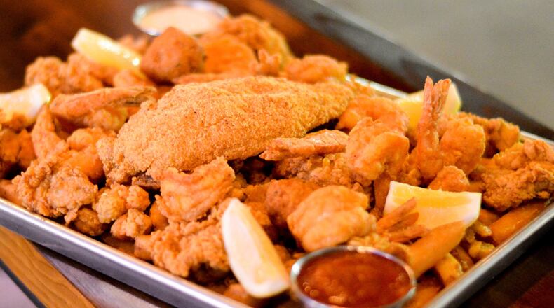 The Heartstopper Fried Feast at Bon Ton includes crawfish, oysters, shrimp, catfish, Cajun fries and hush puppies. CONTRIBUTED BY HENRI HOLLIS
