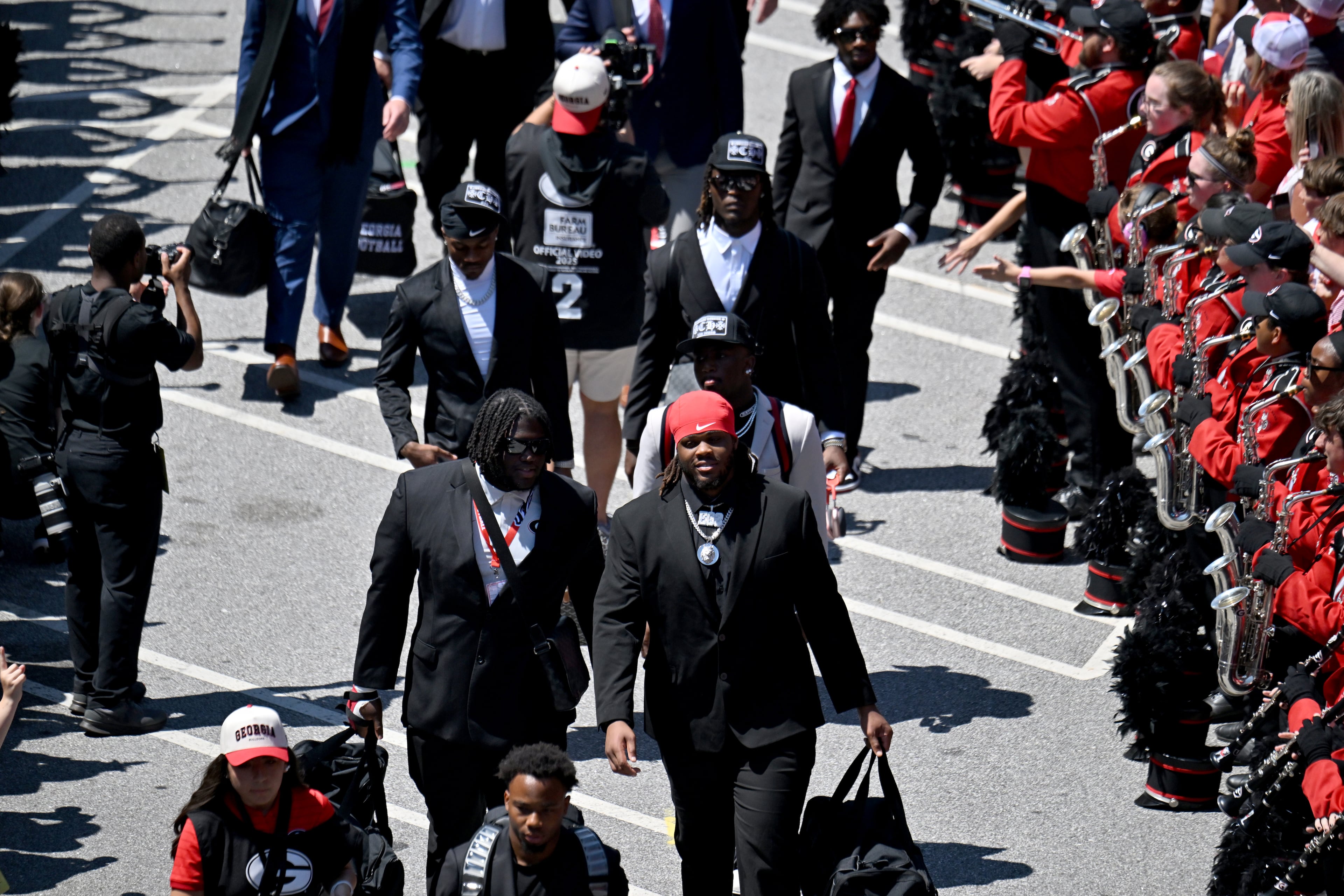 Georgia players and staff arrive during Dawgs Walk before Georgia football's season opener and home opener against Marshall at Sanford Stadium, Saturday, August 30, 2025, in Athens. (Hyosub Shin / AJC)