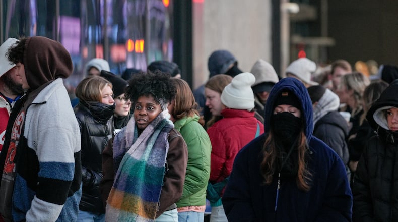 Hundreds line up outside State Farm Arena amid freezing temperatures earlier this month. They were attending the Passion Conference, a youth religious event. (Ben Hendren for the Atlanta Journal-Constitution)