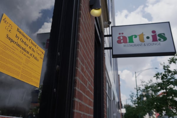 A sign shows Artis Restaurant and Lounge in Chicago has been closed by police on Thursday, July 3, 2025 following a deadly shooting the previous night. (AP Photo/Laura Bargfeld)