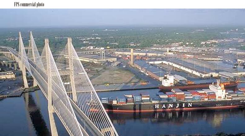 A cargo ship on the Savannah River passes under the Talmadge Memorial Bridge